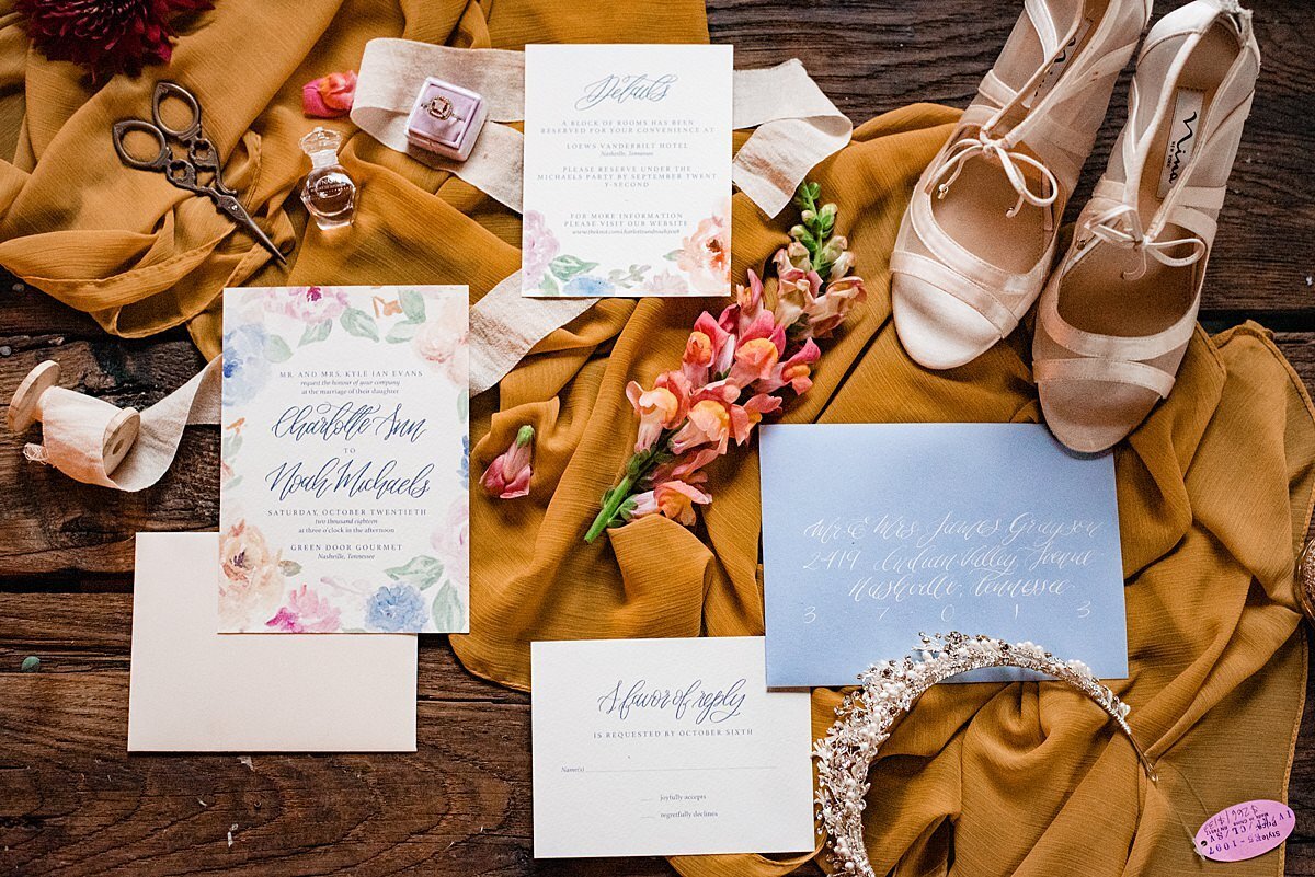 Wedding invitation and bridal details including the tiara and bridal shoes