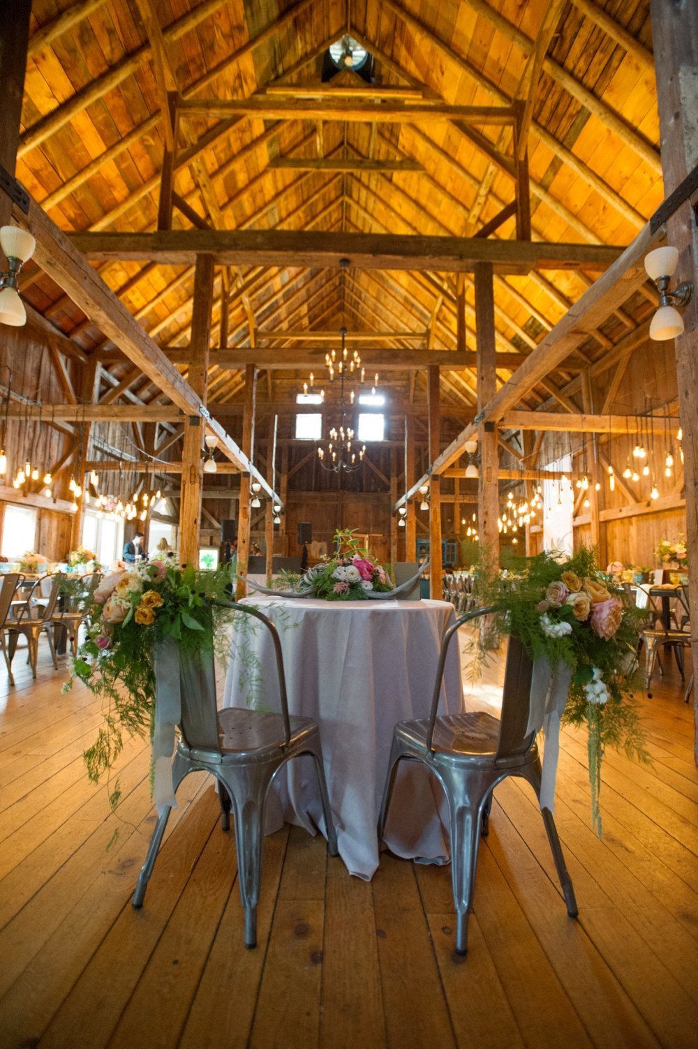Sweet heart table chair decor for barn wedding