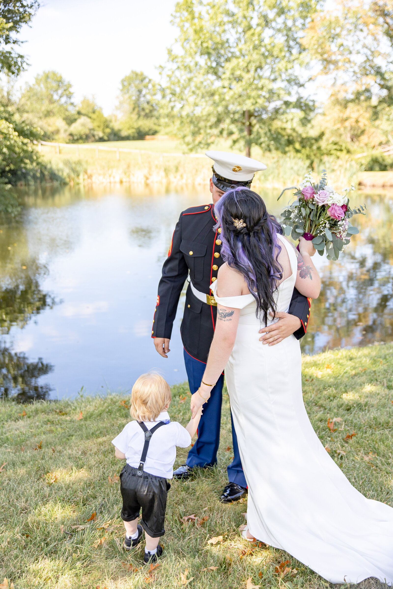 Military groom with his bride and child