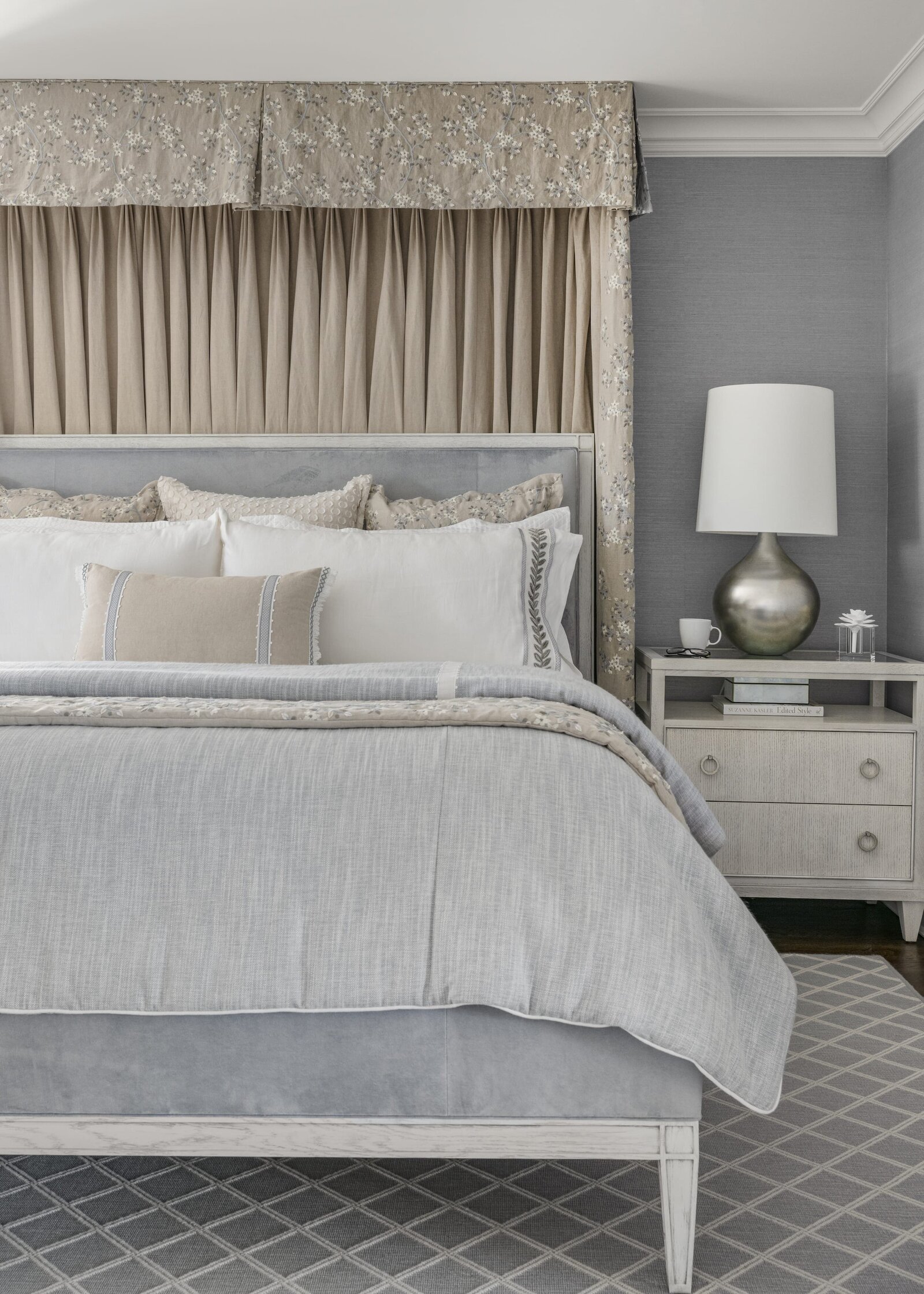 candra lynn interiors ocean port project bedroom with soft blue accents and silver bedside table
