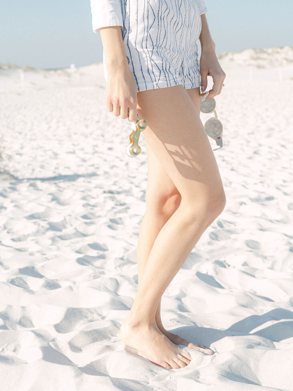 woman on Kaiya beach resort, florida wearing white crop top and shorts by vintage Betsy Johnson