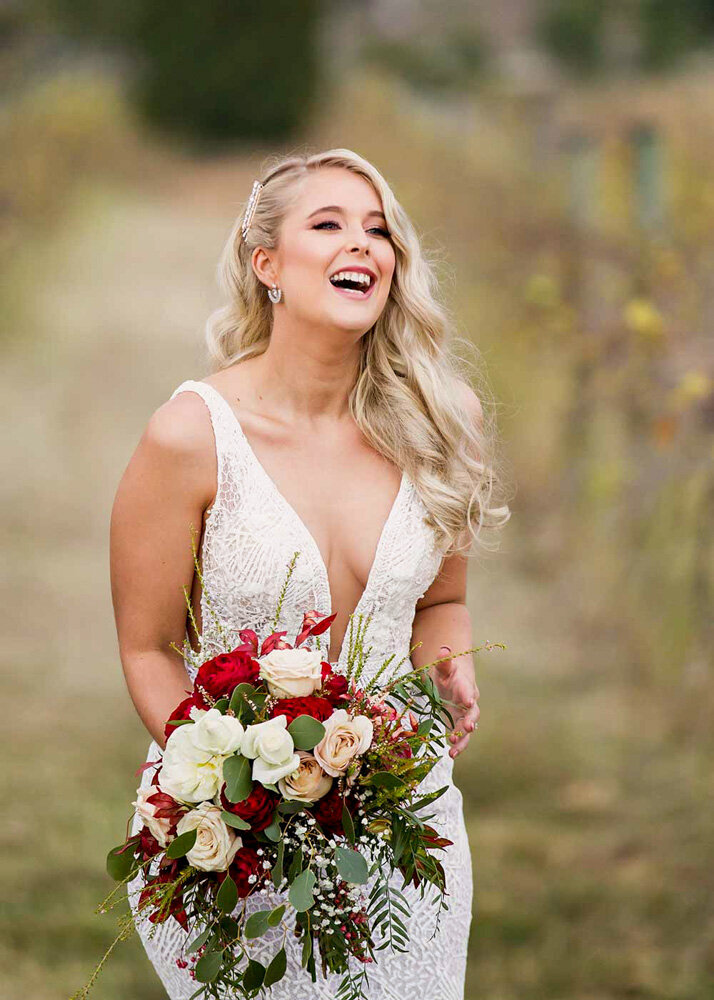 beautiful laughing bride with flowers