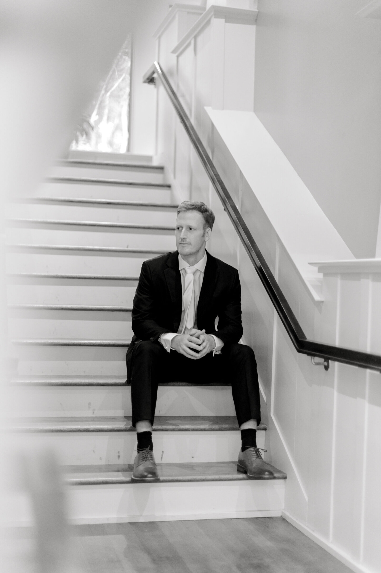 botanic garden wedding groom sitting on stairs