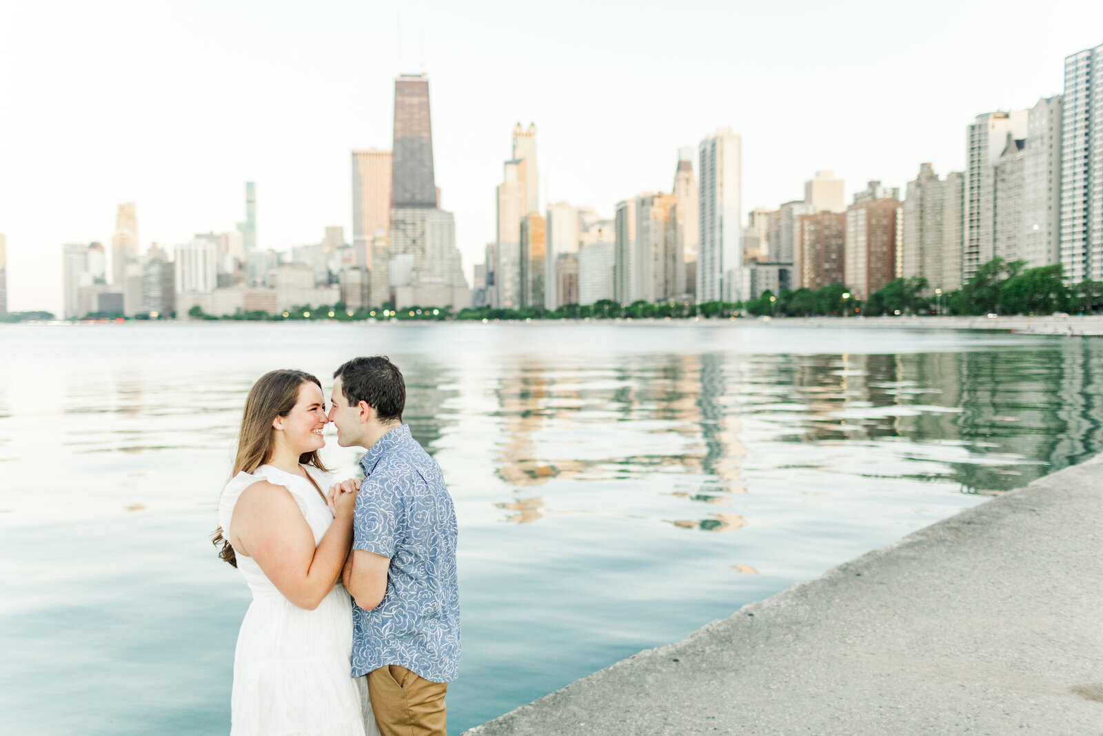 7_chicago_engagement_session_couple_nose_to_nose_with_chicago_skyline