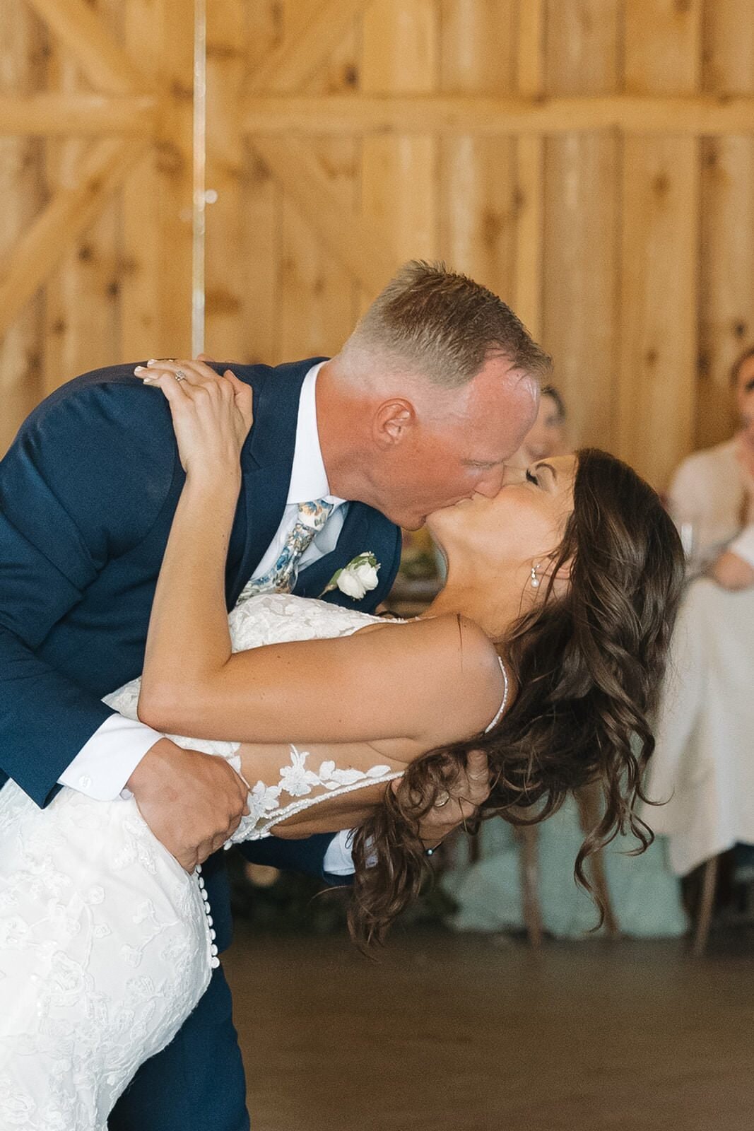 Groom dipping the bride for a kiss during their first dance