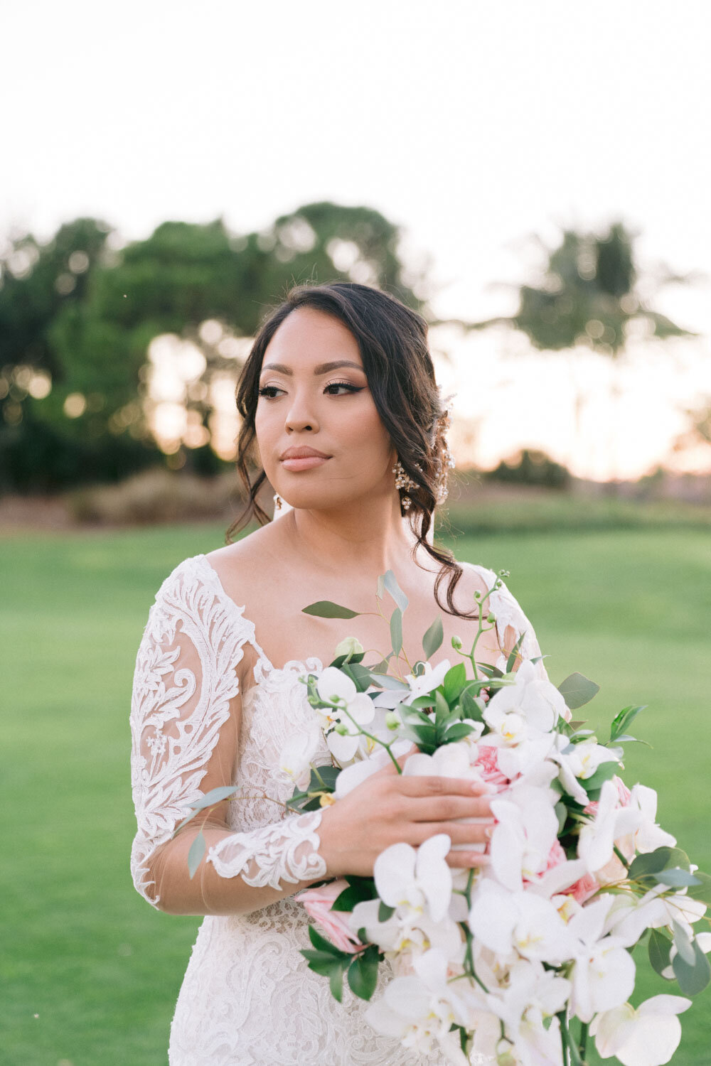 Pretty bride holding her floral buoquet