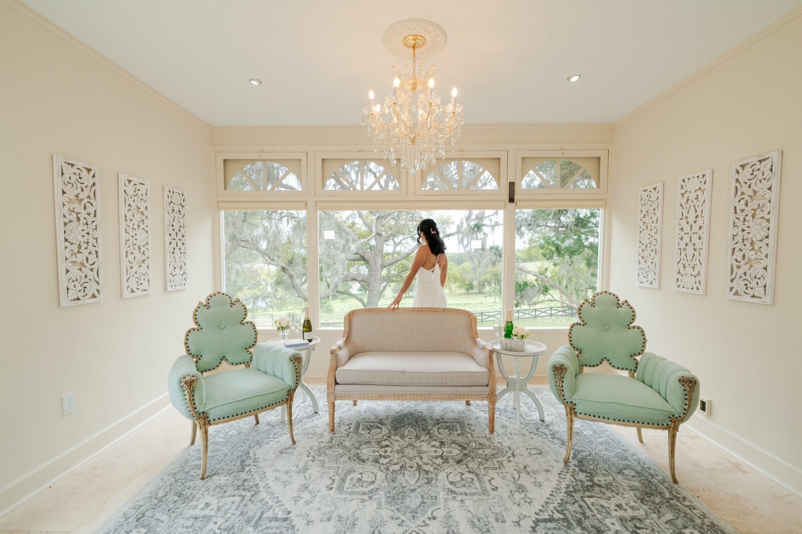 Bride looking out the window from bridal suite
