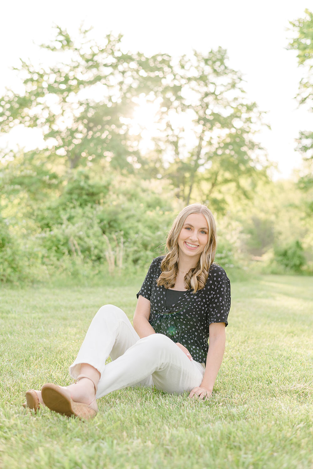 girl sitting and smiling in Vienna, Virginia
