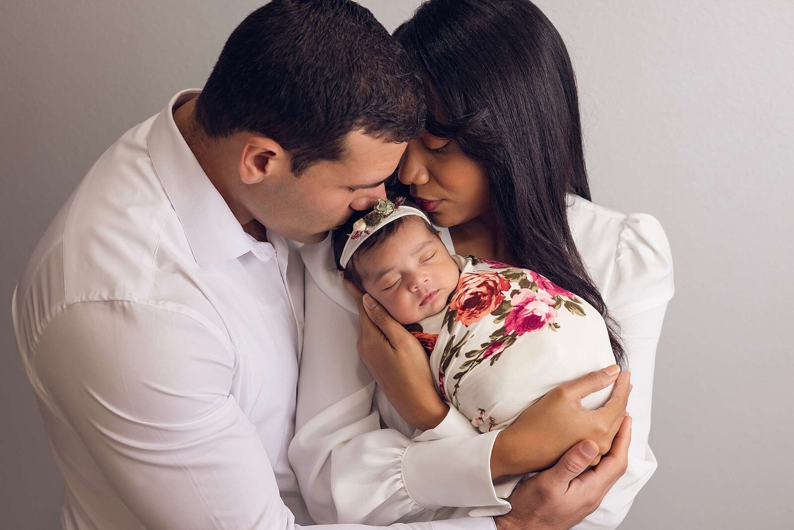 A serene newborn portrait captured in a cozy Central Florida home, showcasing the beauty of family connections.