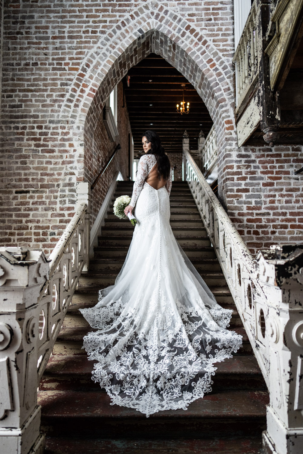 Bridal portrait on stairs at Felicity Church in New Orleans