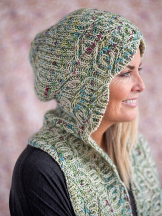 Natural makeup for a model wearing a green knit hat