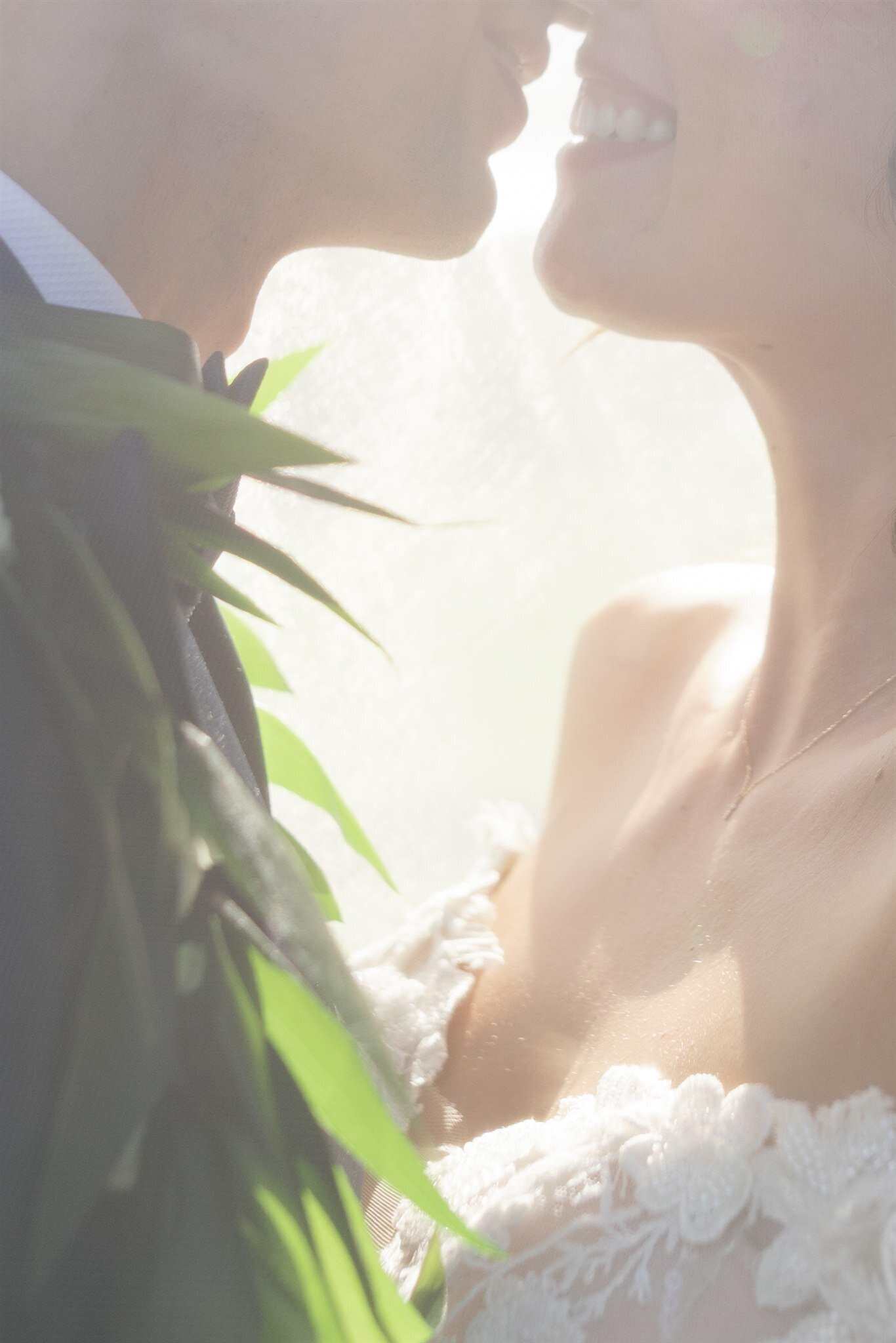 A close up view of a newlywed couple standing close together 
