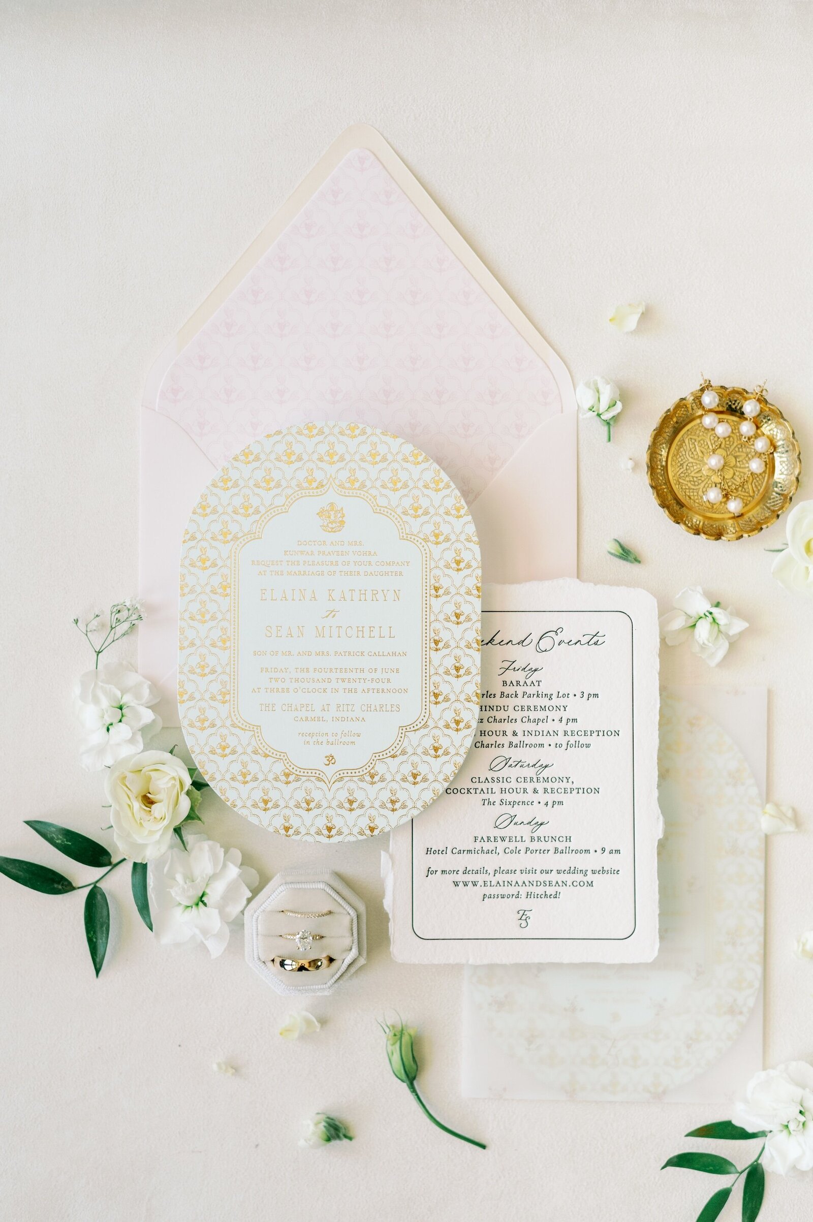 a wedding stationery suite with gold embellishments