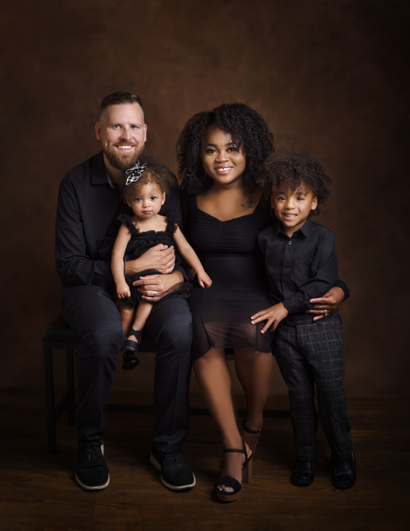 studio photographer family posing fine art black brown