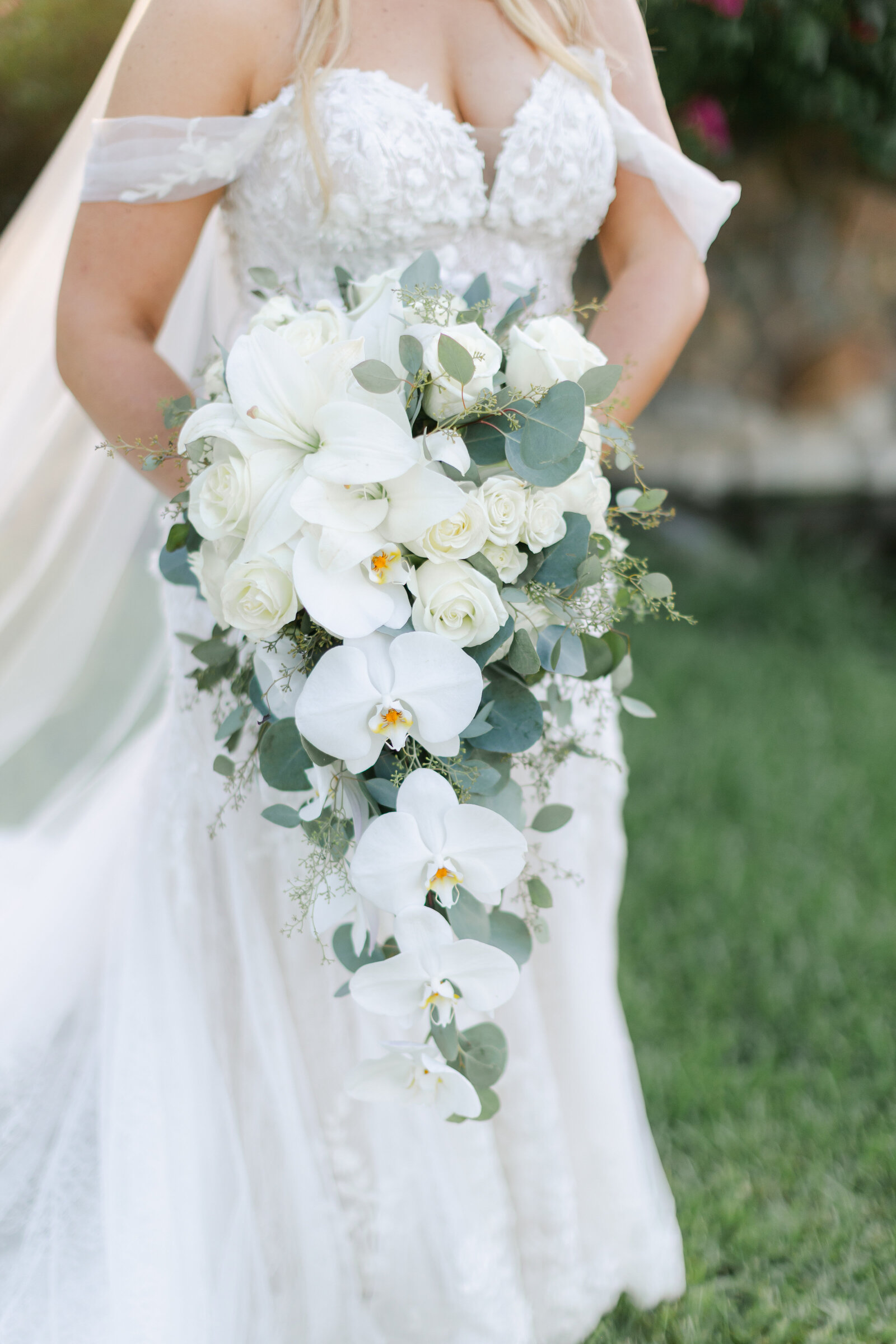 bride holding elegant floral bouquet at a luxury Palm Beach Wedding in South Florida. Photo by Maggie Alvarez Photography