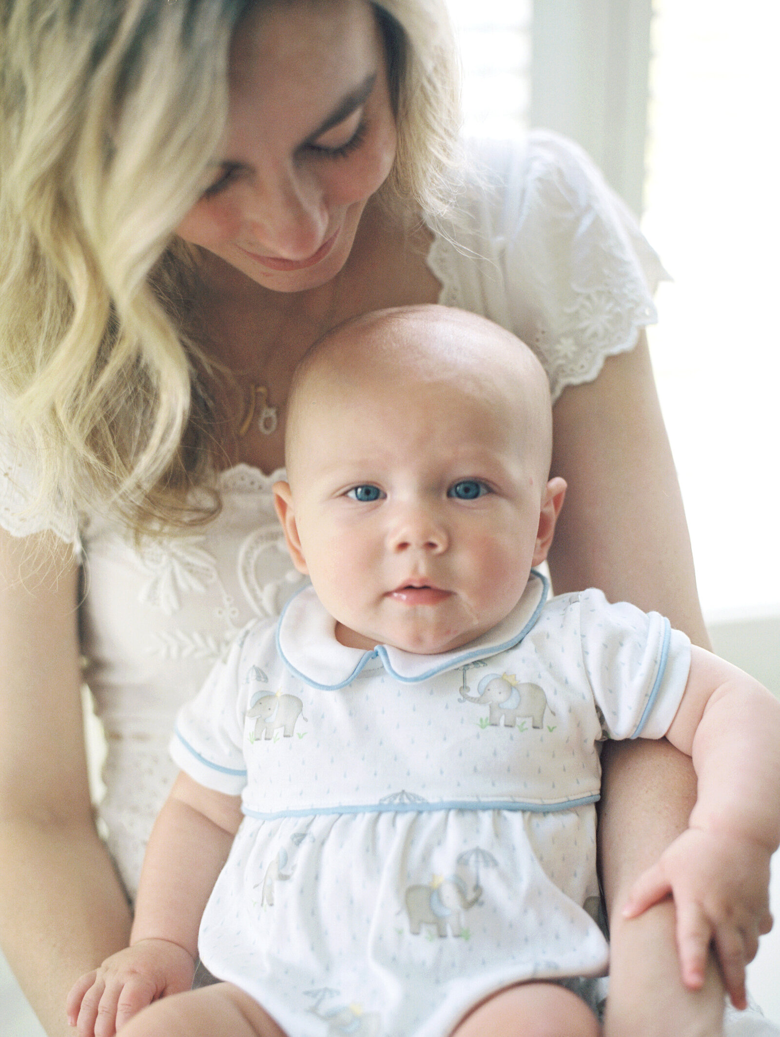 film photo of newborn boy on mother