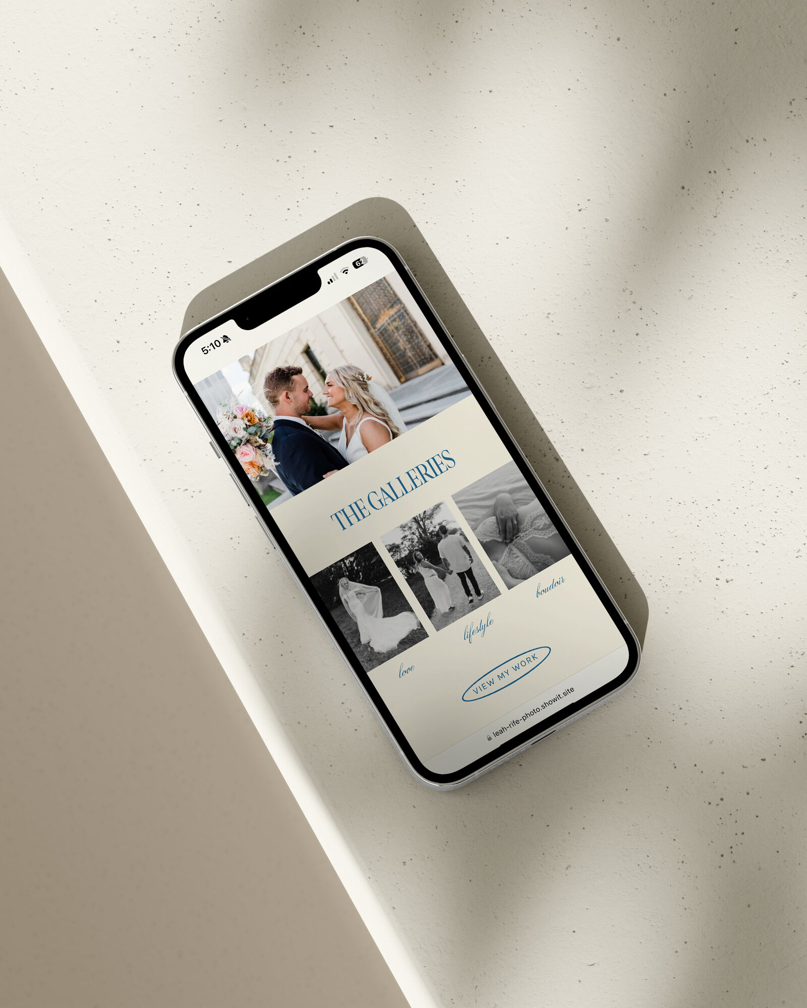 Mobile phone displaying photography website portfolio