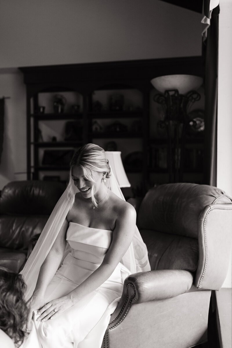 Bride putting on shoes by elopement photographer washington state Erica Rochelle Photography