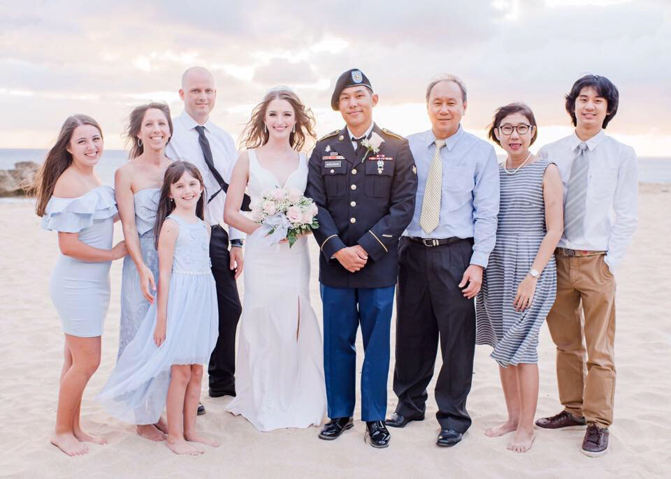 Hilton Hawaiian Village Wedding Photography, bride and groom with family for a group shot at the beach