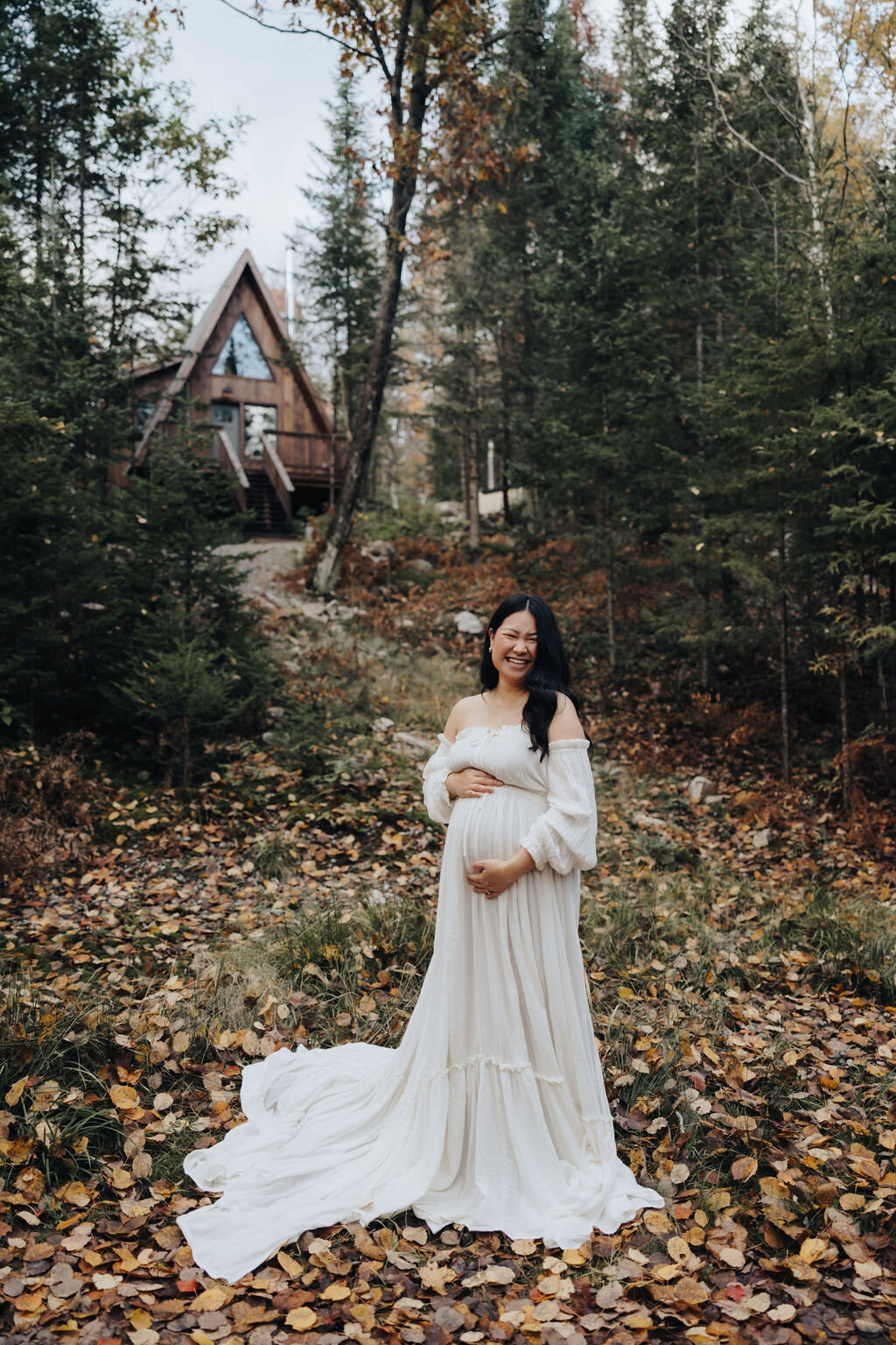 Pregnant asian woman in white dress