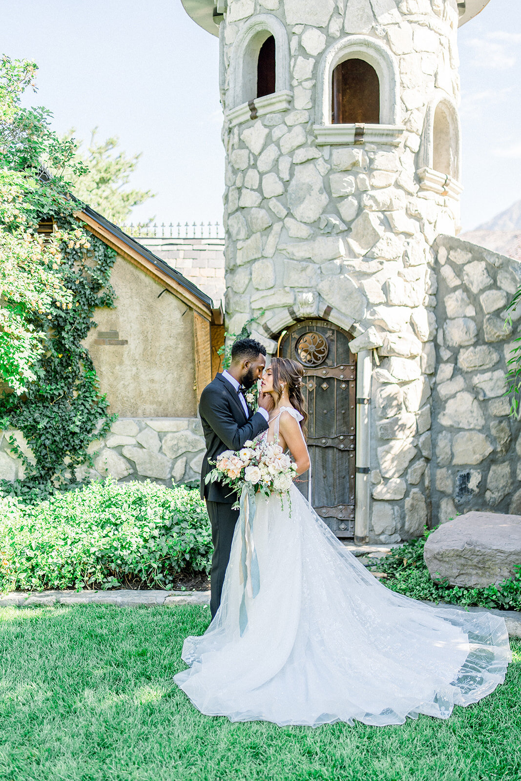 Bride and groom with wedding bouquet at White Swan Castle in Granite Bay, CA