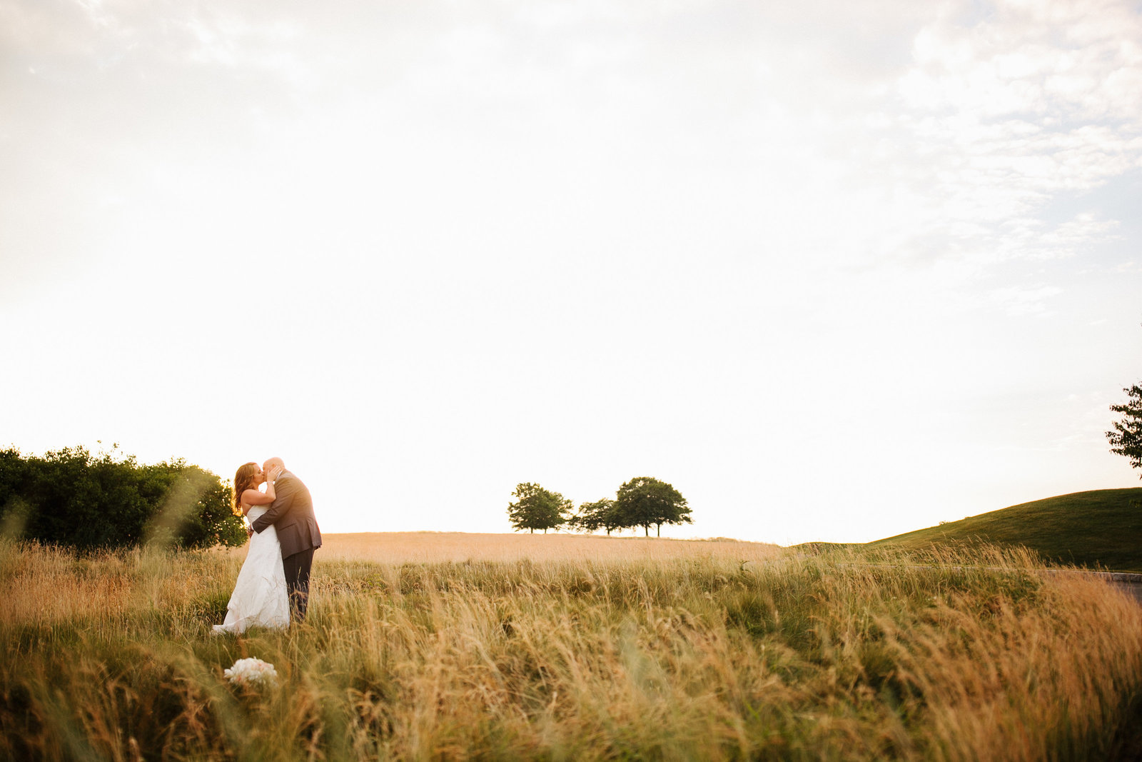 Bride and groom photographed in the fields of the historic Valley Forge Park.