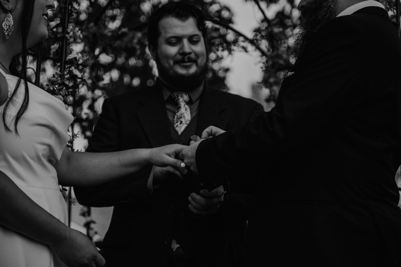 bride and groom exchange rings in arizona wedding