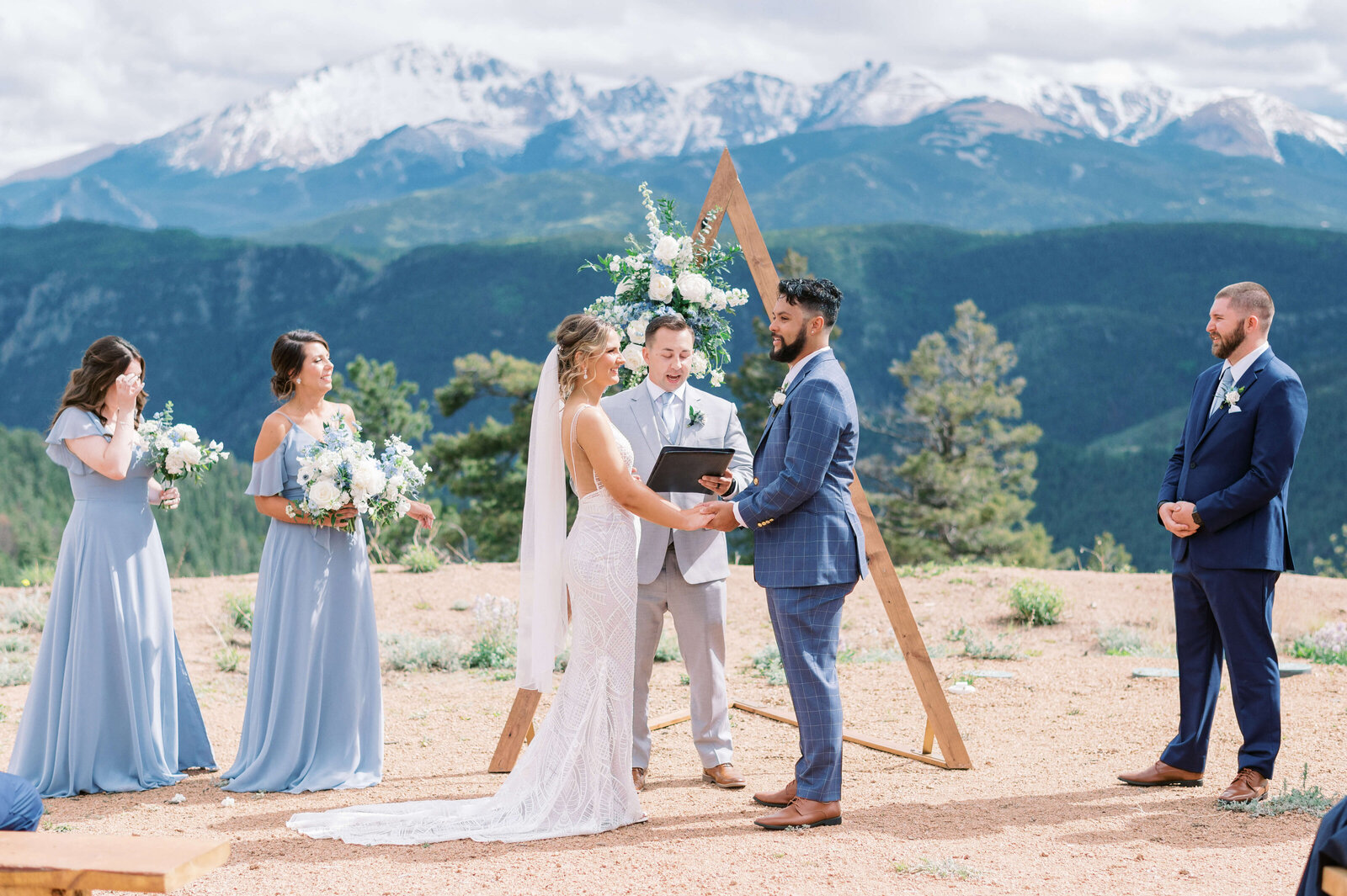 A beautiful wedding ceremony in front of the mountains during summer