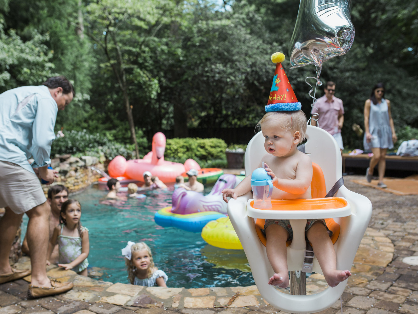 mother walks hand in hand with daughter and holds small child at Myrtle Beach beautiful moment with family photographer jamie lucido