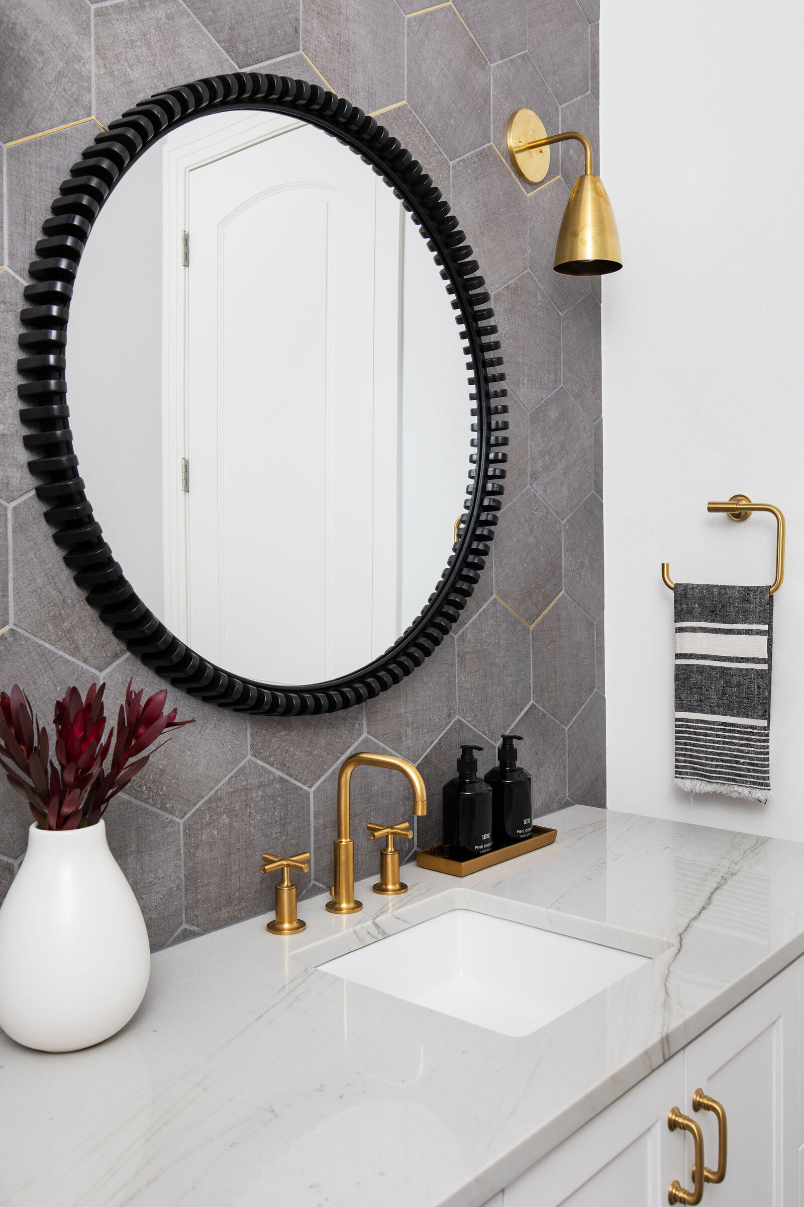 gray+hexagon+wall+tile+gold+faucet+lighting+bathroom+remodel+nuela+designs+interior