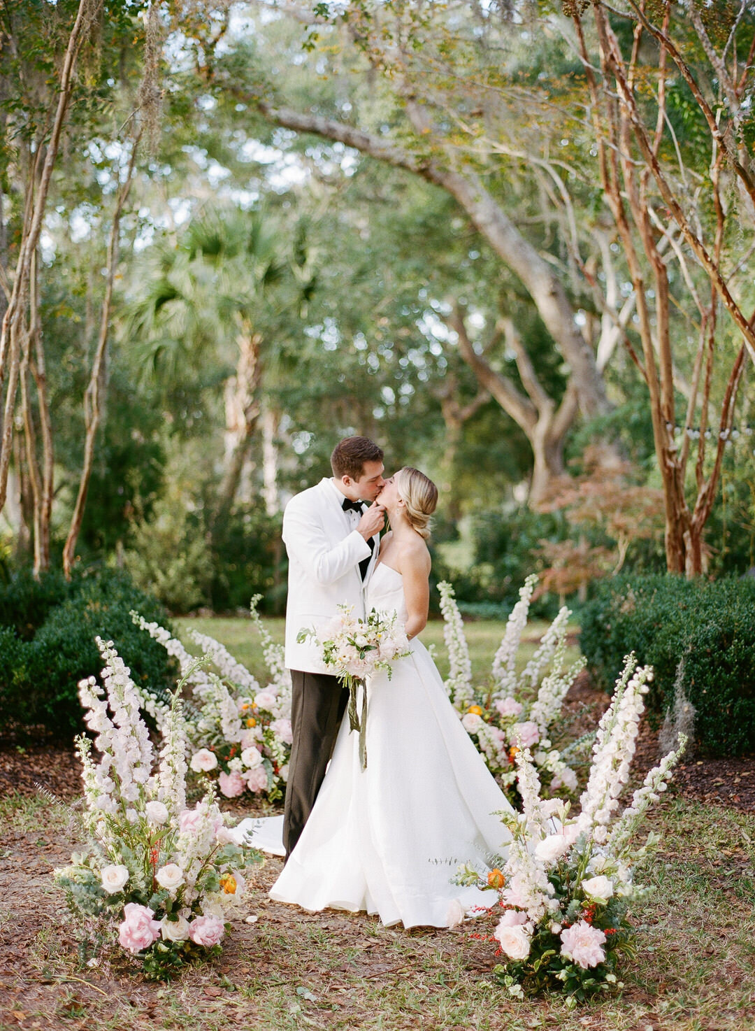 Bride and Groom Kissing at Ceremony Alter