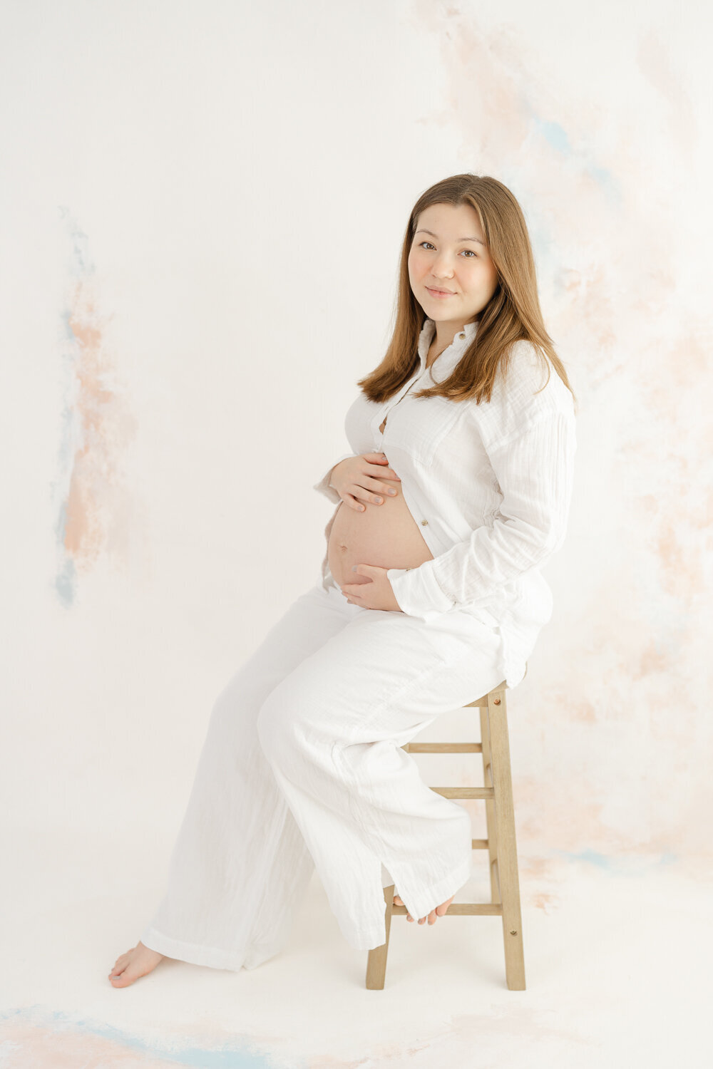 mom posing during studio during maternity photography