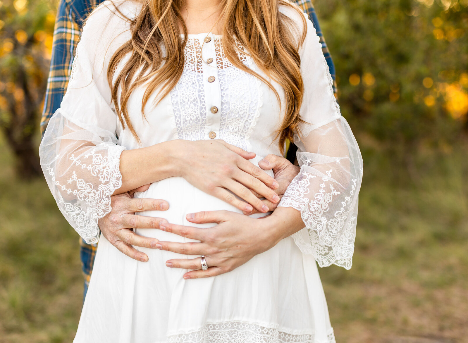 belly shot with mom and dad hands