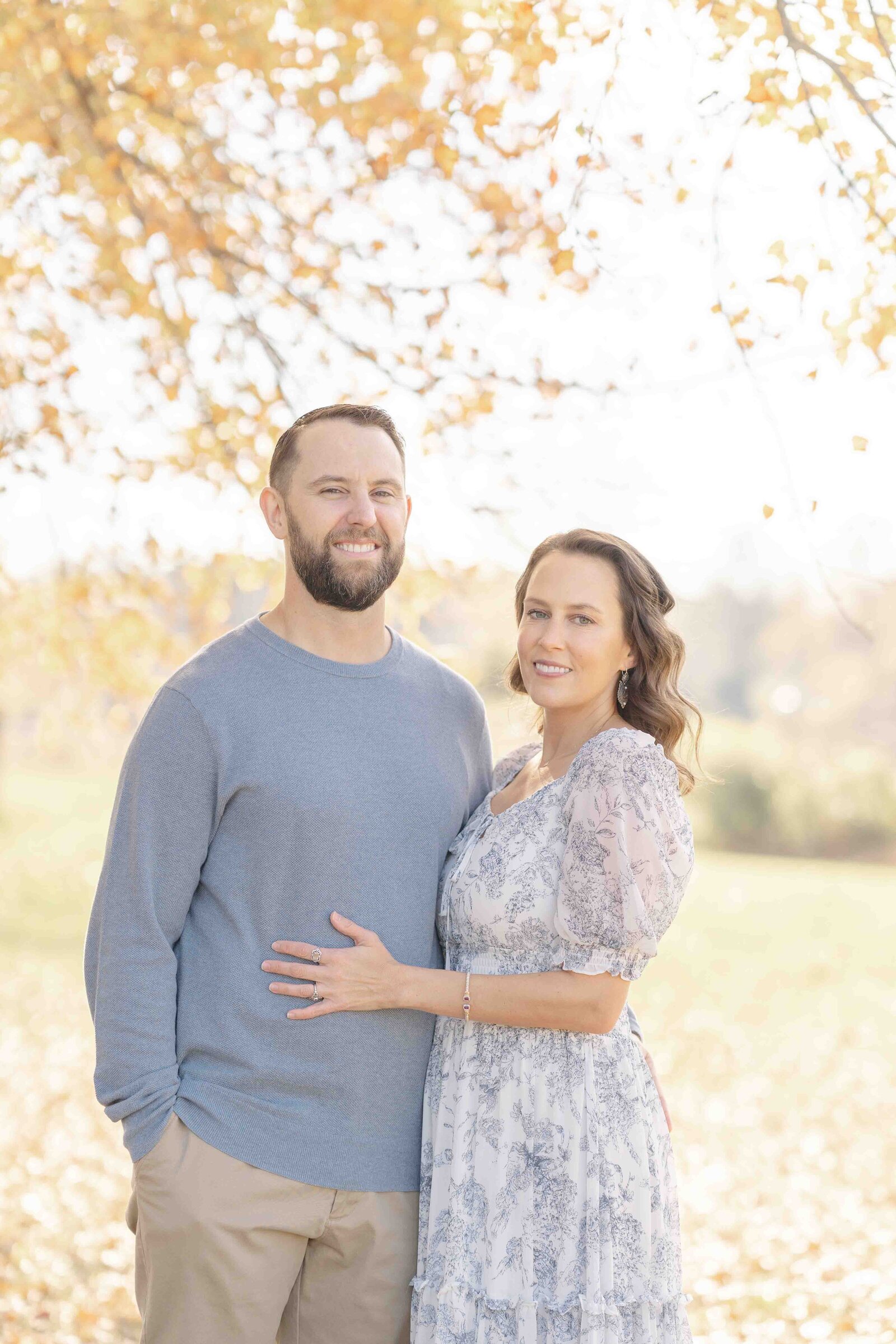 parents smiling during  fall mini session in Haymarket, Virginia