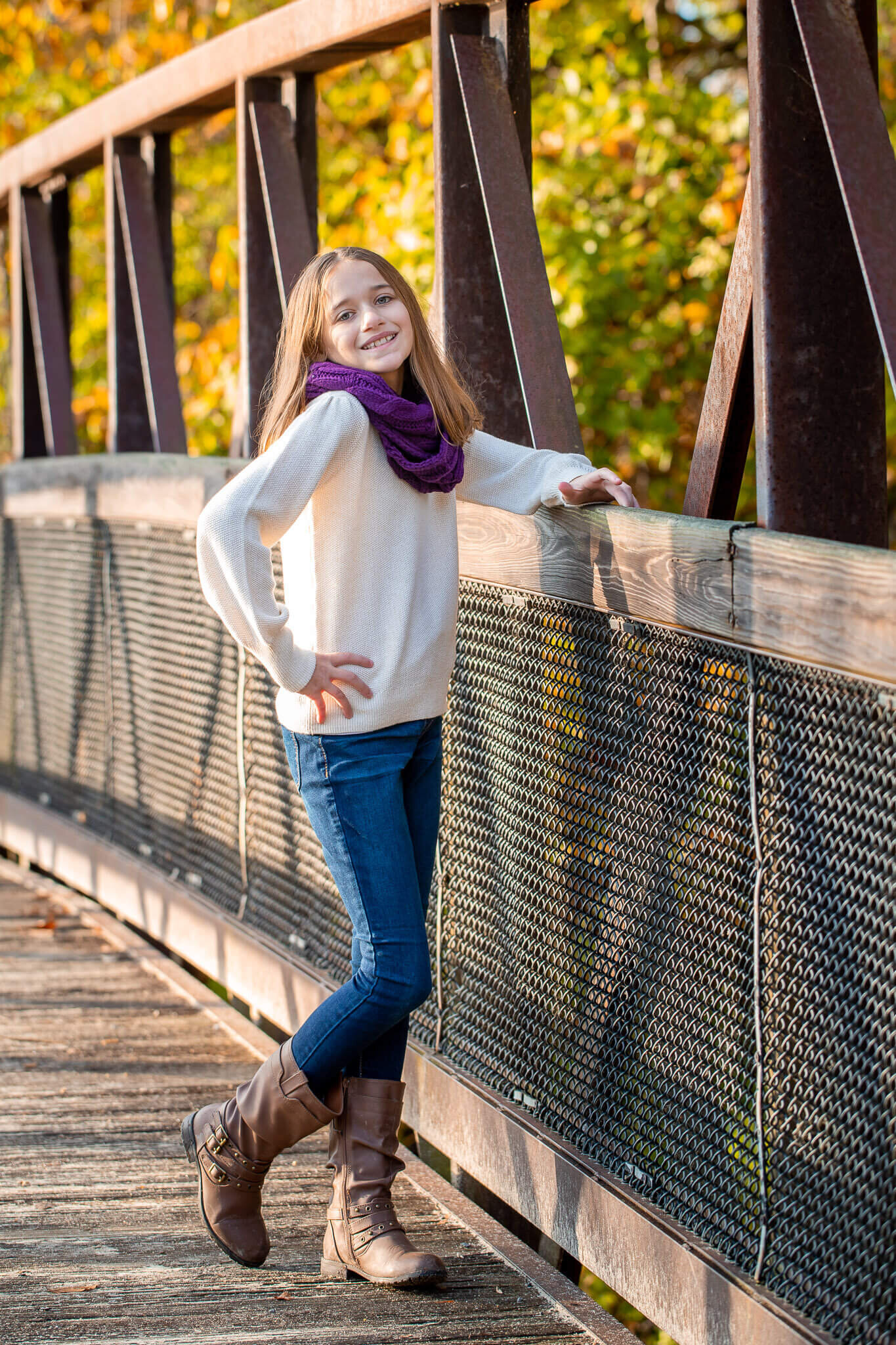A girl posing on a bridge during a Springfield family photo session.