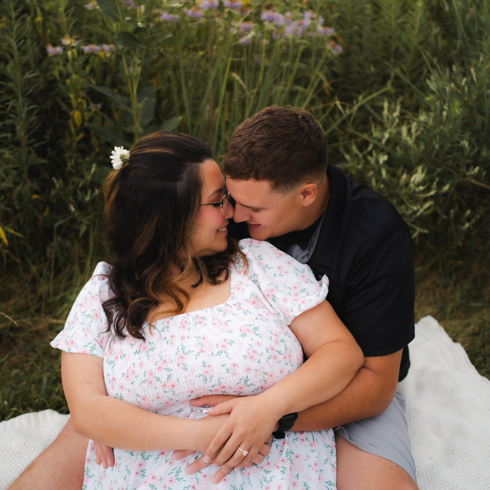 dreamy romantic engagement photos of an engaged couple sitting on a blanket at Ledges State Park Des Moines Iowa
