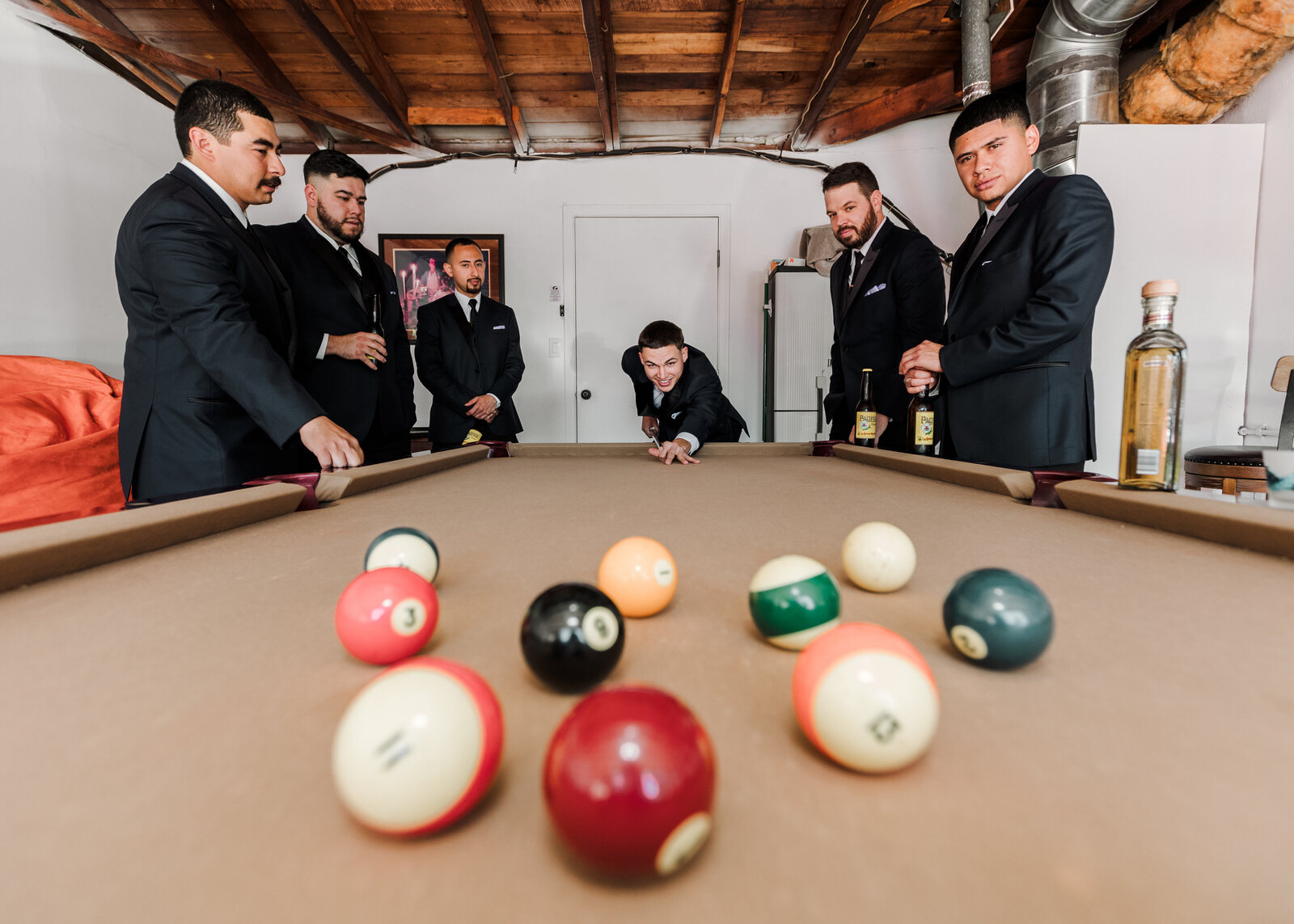 Groom and Groomsmen take a moment to relax in Santa Ana before the Wedding
