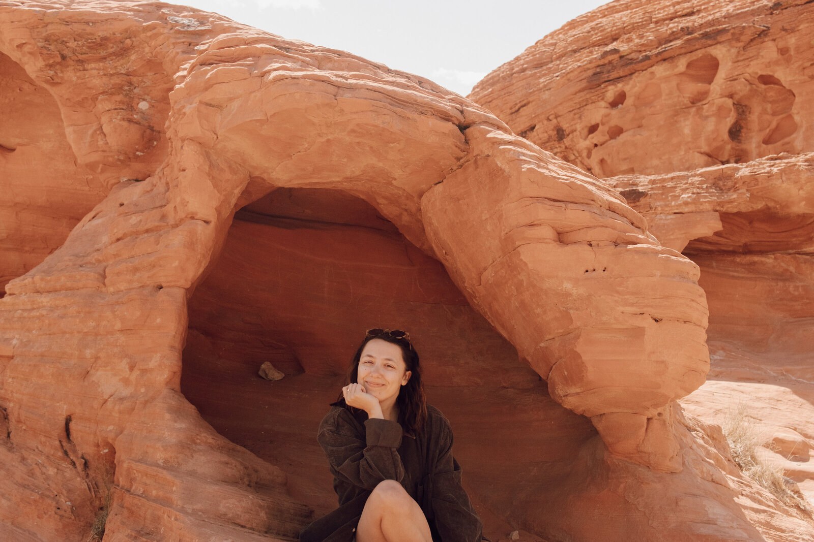 girl smiling on red rock