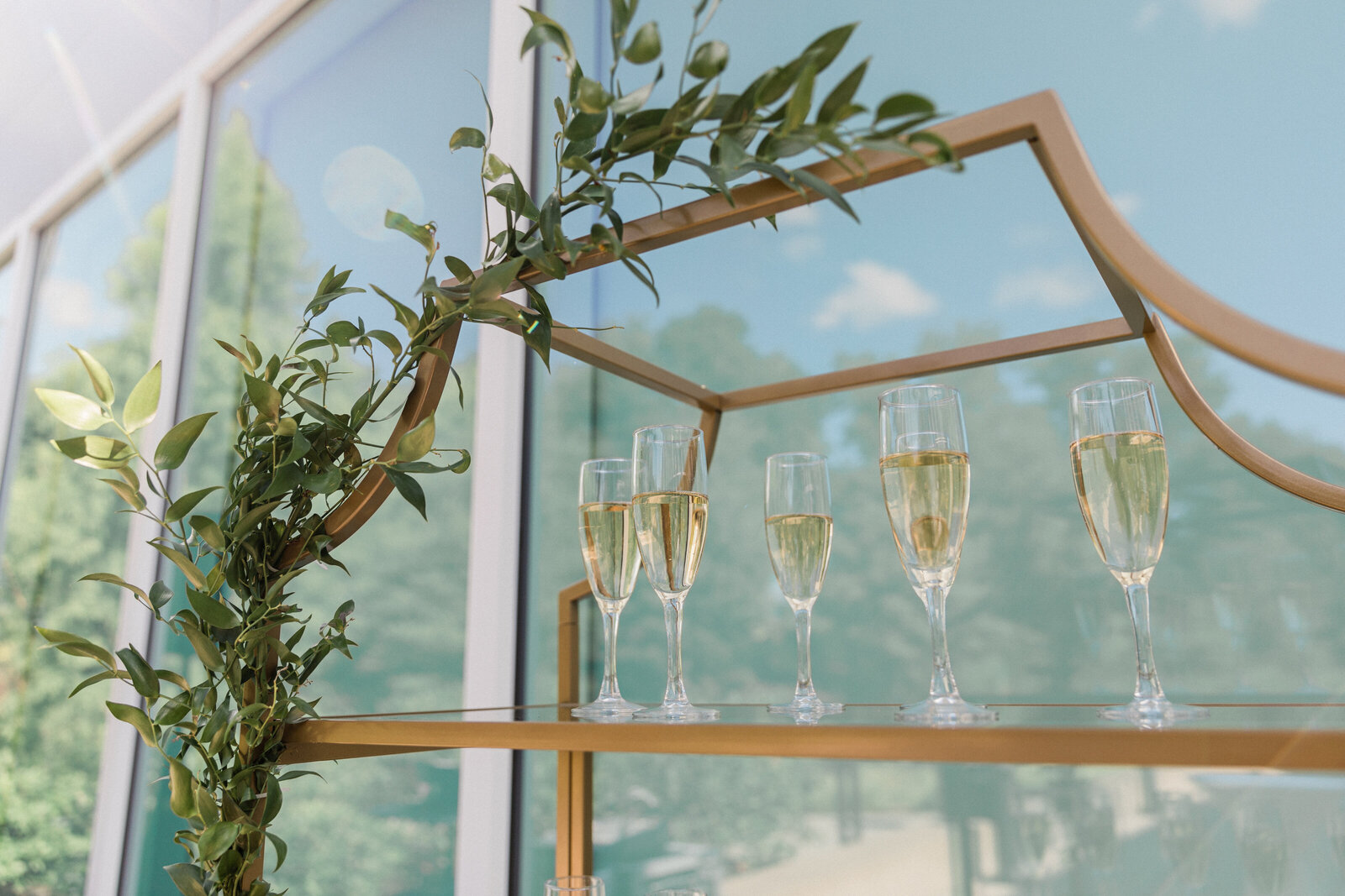 glass shelves with champagne flutes