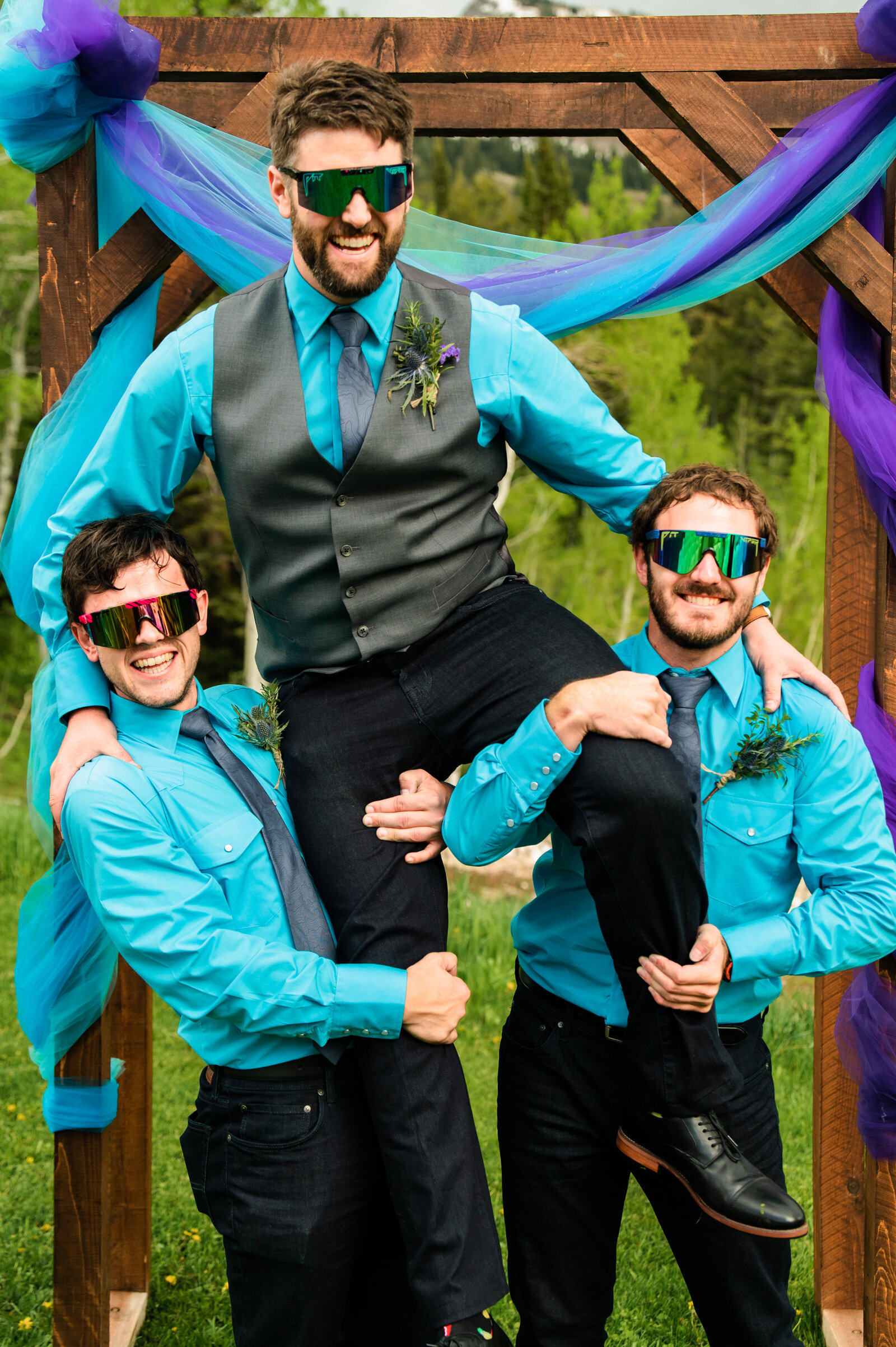 Jackson Hole videographer captures groom being lifted up by wedding party after Jackson Hole elopement