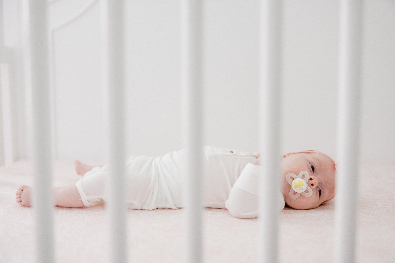 baby laying in crib