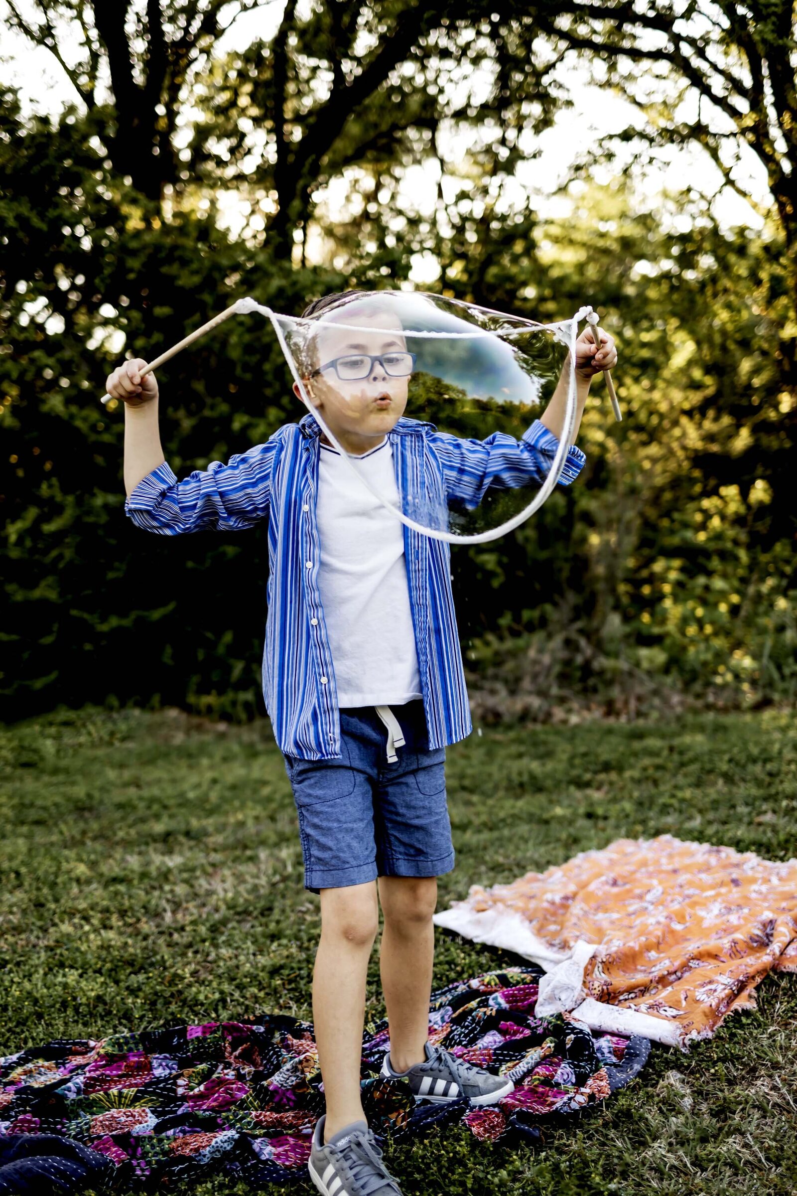 southlake texas resident plays with bubbles at Liberty Park in Southlake 