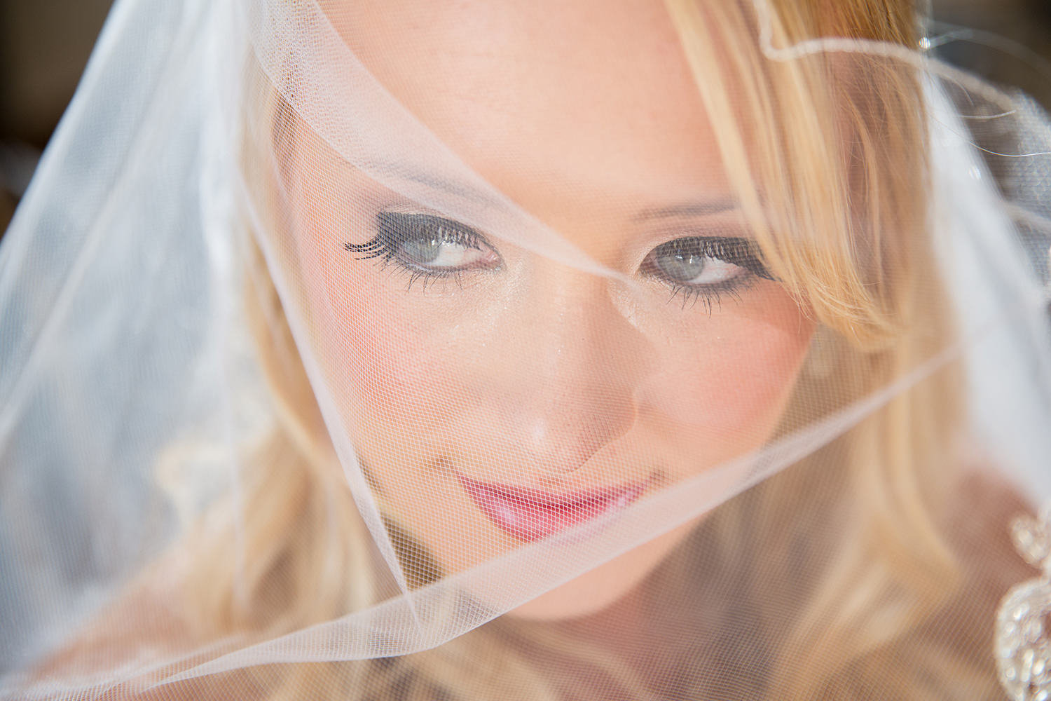closeup with bride veil over face