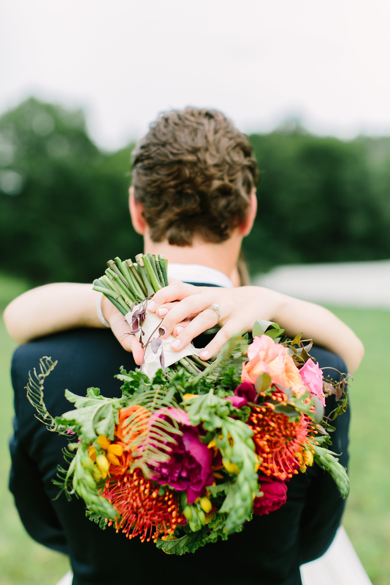 groom with bridal bouquet