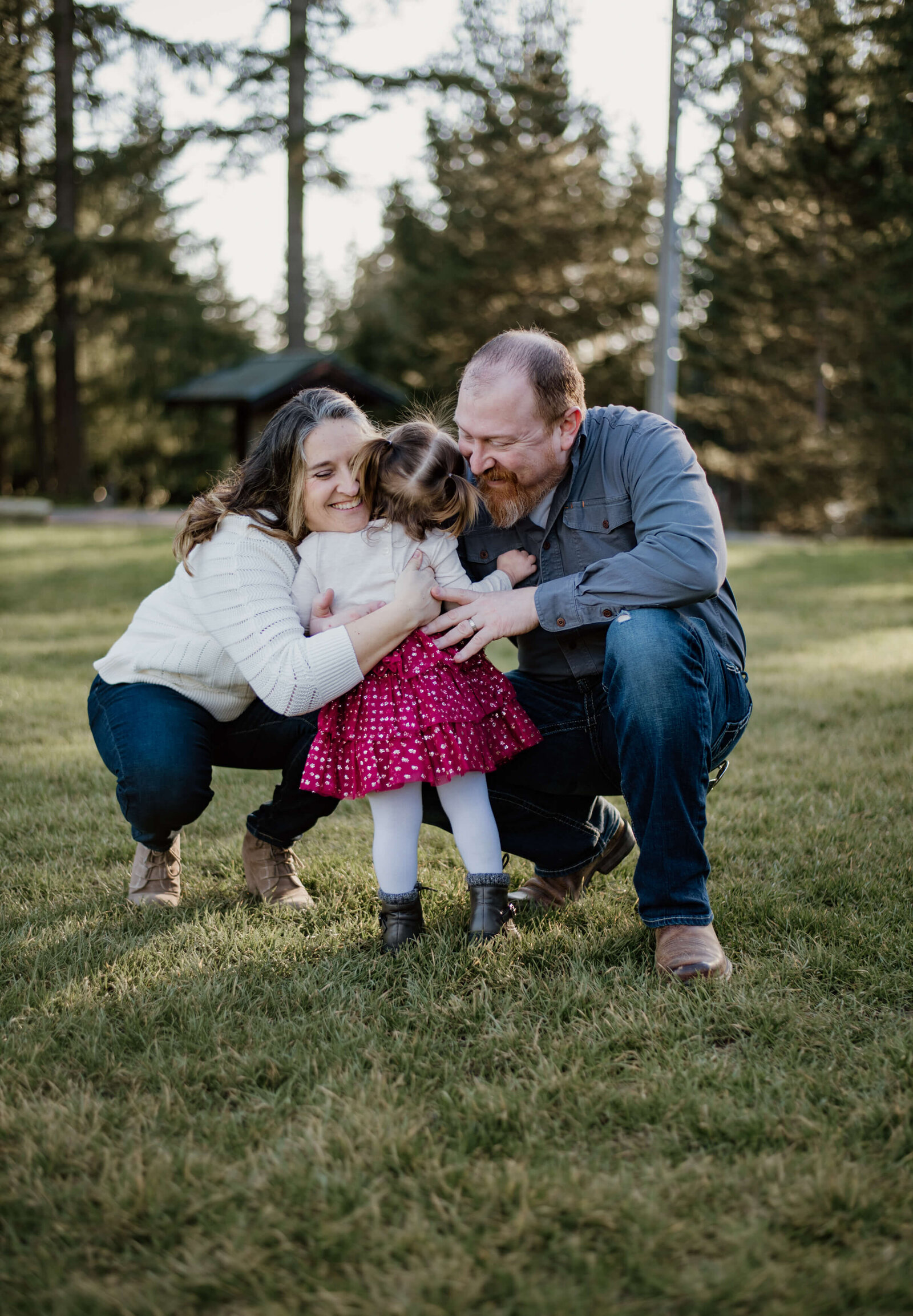 Little girl hugging her Grandparents.