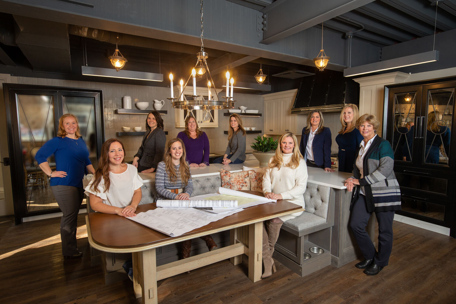 Interior design team gathered in a stylish kitchen setting