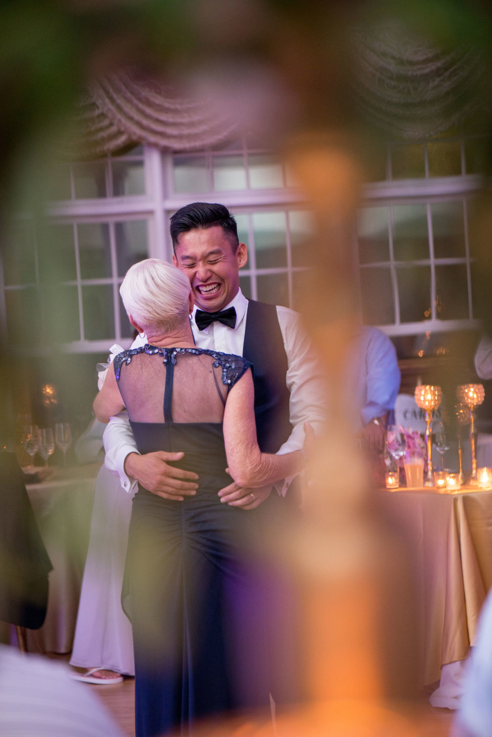 Groom and guest dancing at Camp Pa-Qua-Tuck