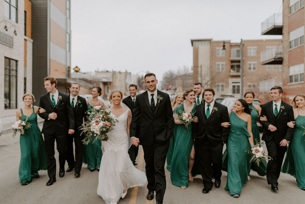 Wedding party walking down a street in Sun Prairie Wisconsin