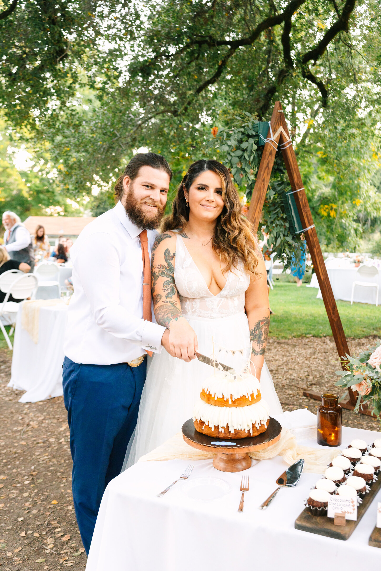 Tattoo bride and groom at their colorful wedding reception in Santa Cruz, California.