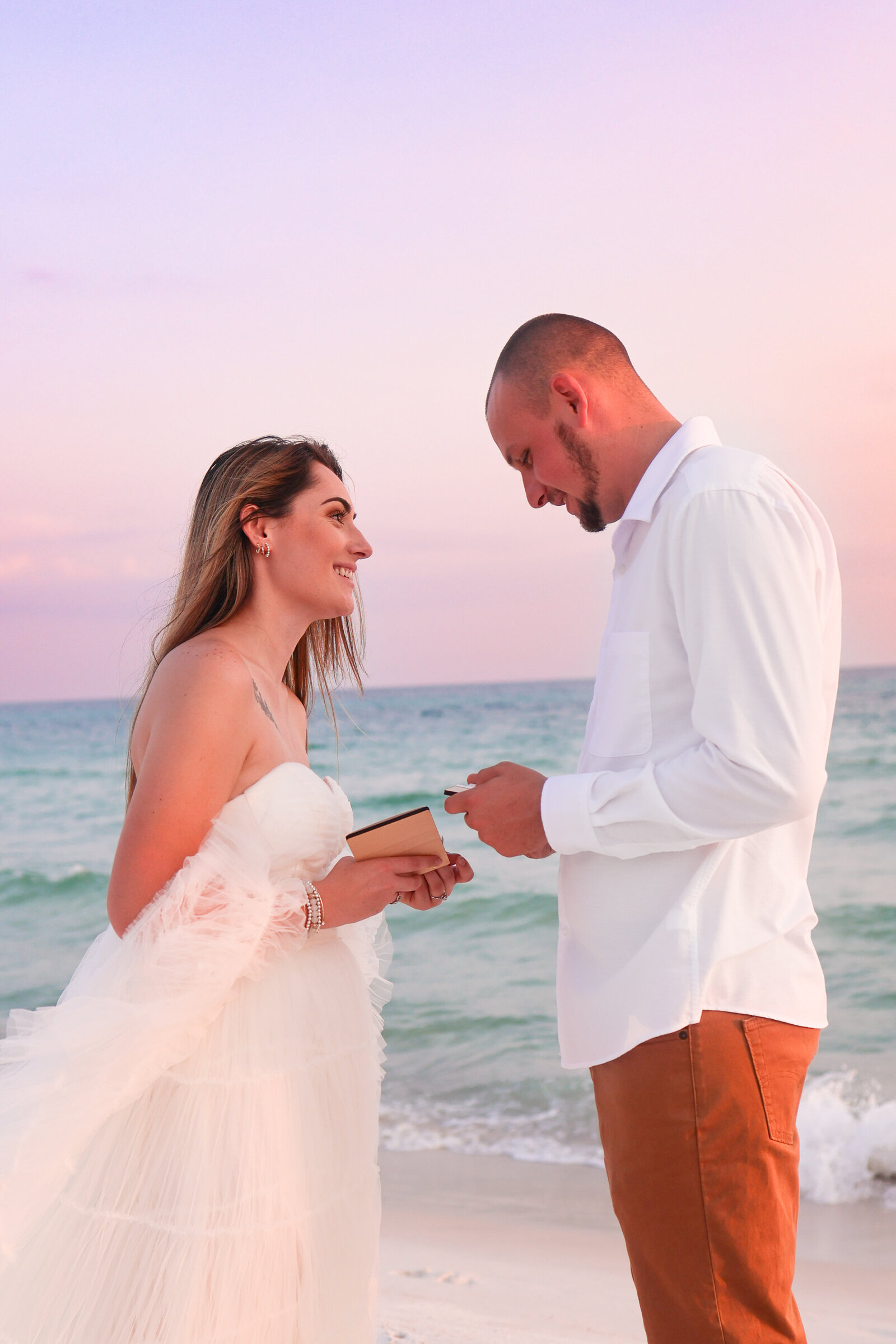 bride and groom saying vows on beach in panama city beach